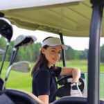beautiful-cheerful-young-woman-driving-golf-cart